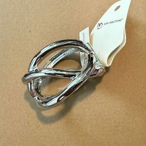 NWT New directions Silver tone knot bangle bracelet. Retail: $28